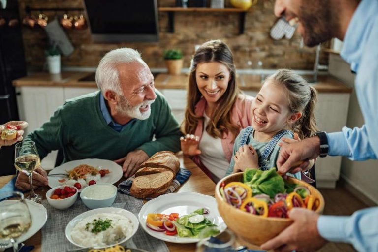 happy-extended-family-having-fun-while-talking-during-lunch-dining-room-focus-is-little-girl-fotor-2023091515117